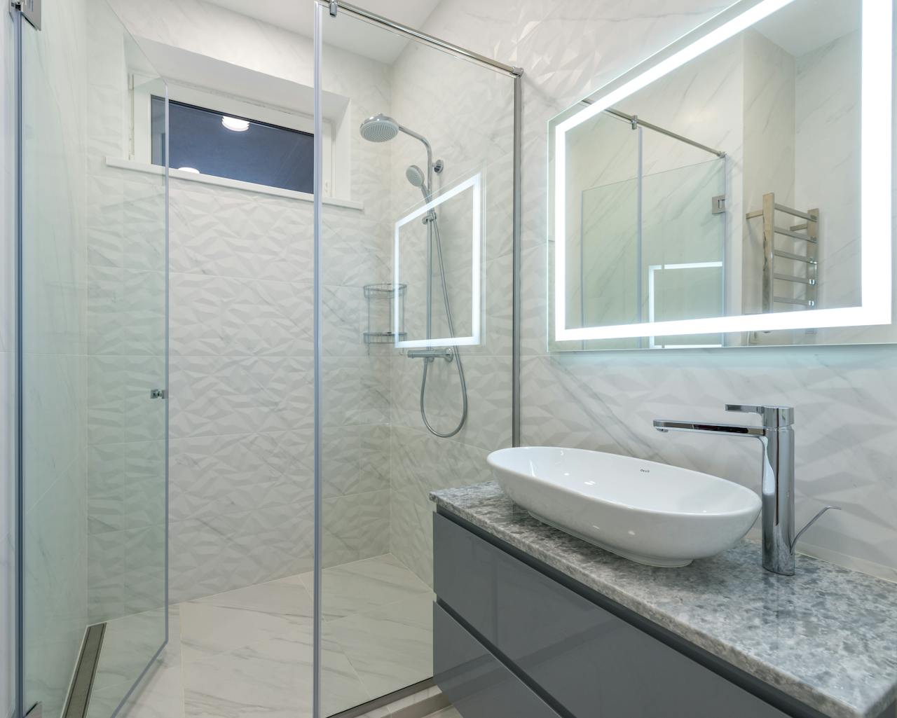 brand-01 Stylish mirror illumination shining in bathroom above sink with faucet and shower cabin